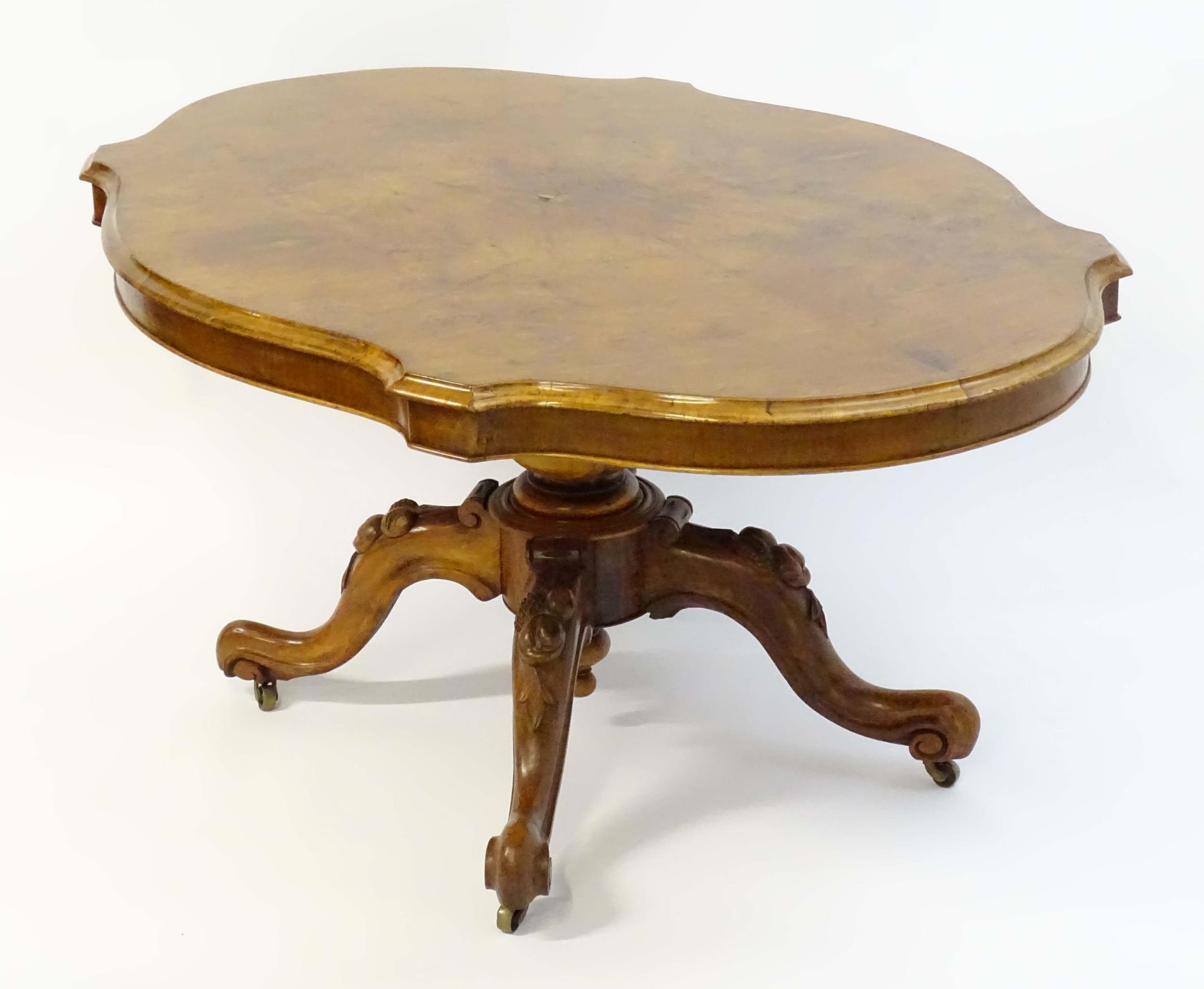 A mid 19thC walnut loo table with a burr walnut veneered top above a turned pedestal base and four - Image 12 of 12