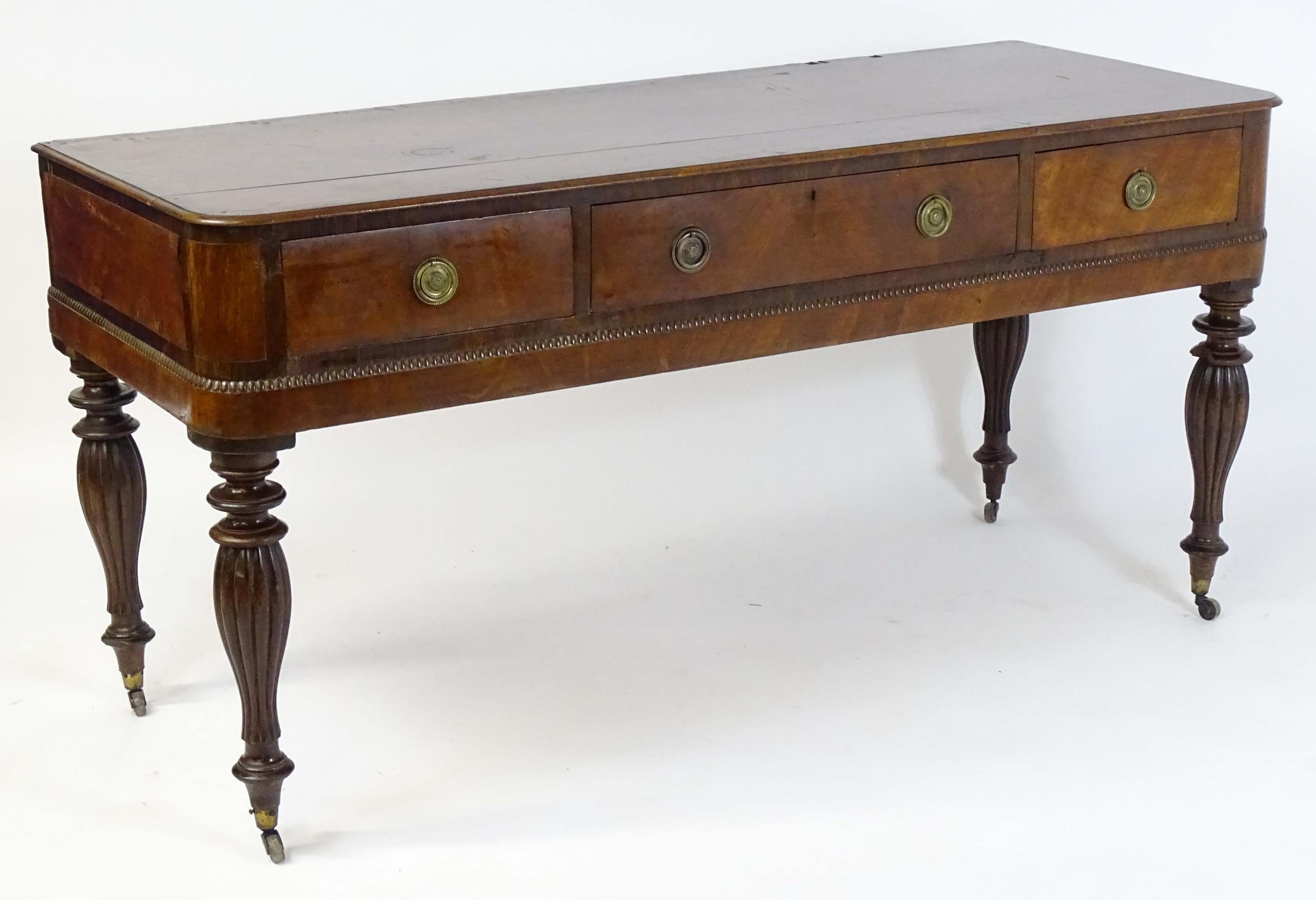 A 19thC mahogany sideboard with a moulded top above one long drawer and two short drawers with