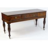 A 19thC mahogany sideboard with a moulded top above one long drawer and two short drawers with