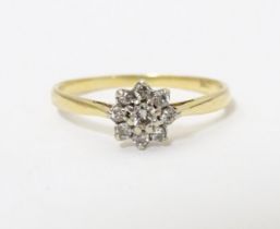 A 18ct gold ring set with diamond cluster to top. Ring size approx. Q 1/2 Please Note - we do not