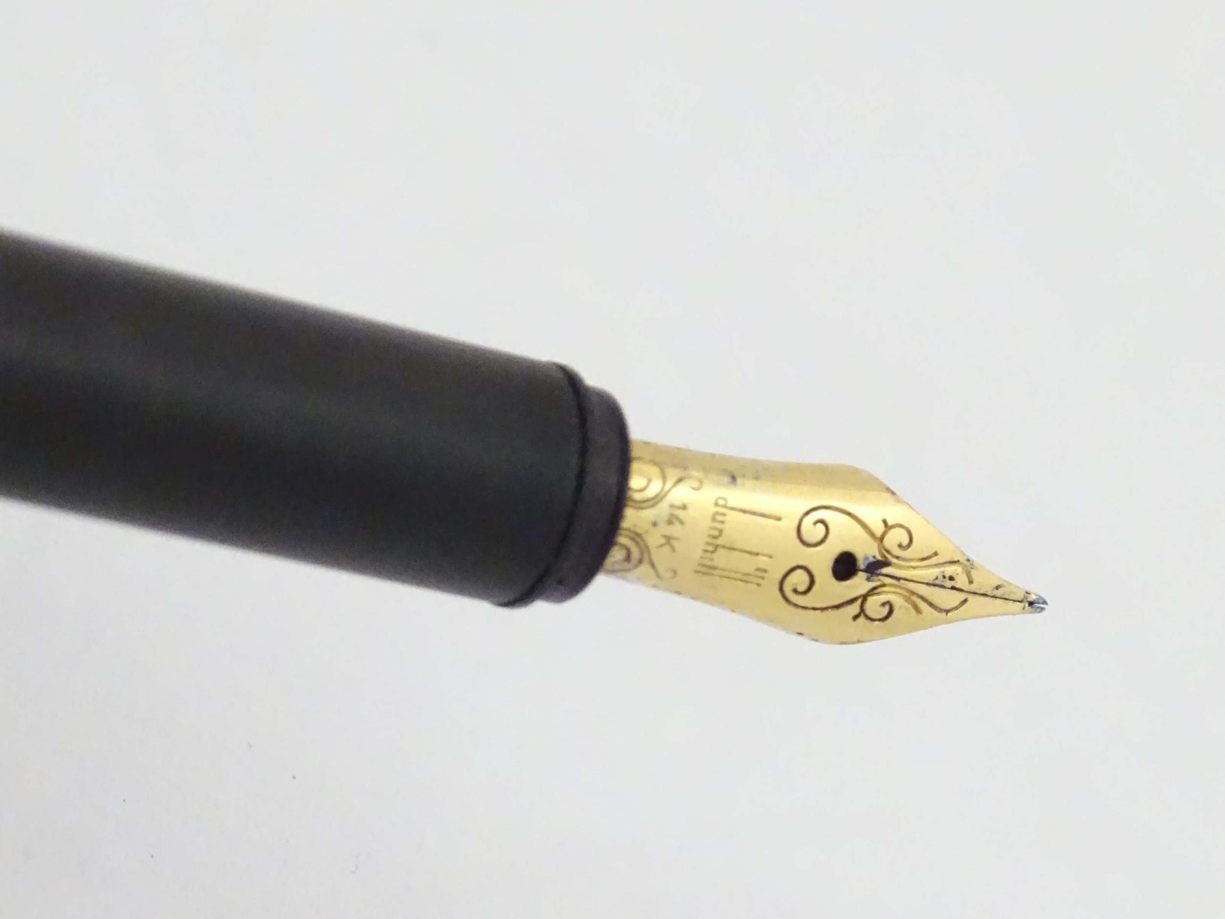 A Dunhill fountain pen, with rolled finish, gilt mounts and 14K gold nib. Approx. 5 1/2" long Please - Image 6 of 9