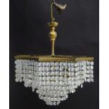 An early 20thC crystal drop bag pendant ceiling light, of octagonal form, the gilt brass frame