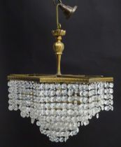 An early 20thC crystal drop bag pendant ceiling light, of octagonal form, the gilt brass frame