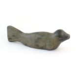 A 20thC Canadian Inuit carved soapstone model of a seal. Approx. 13 1/2" wide Please Note - we do