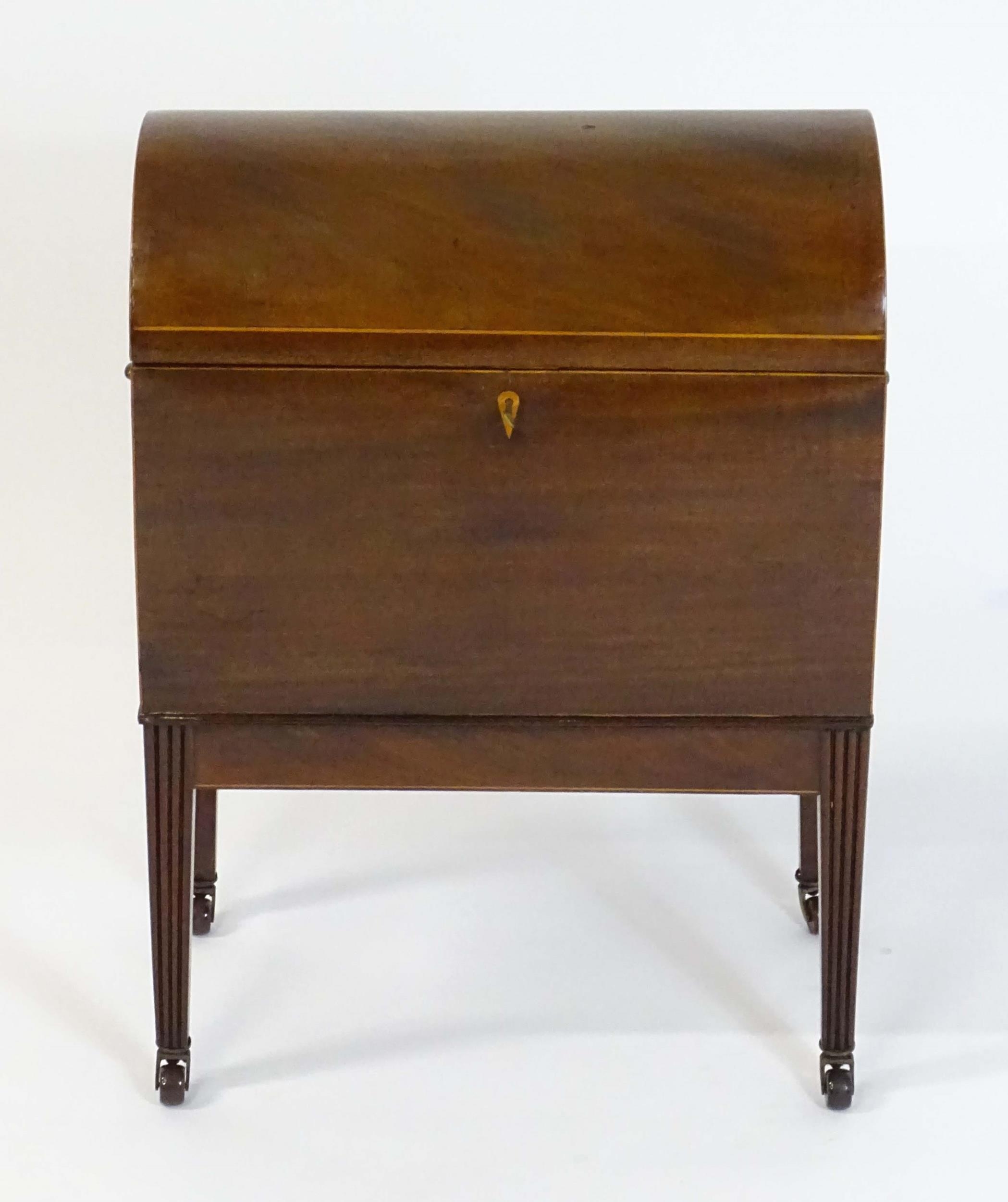 A George III mahogany domed lidded cellarette fitted with dividers for eight bottles, flanked by - Image 6 of 10