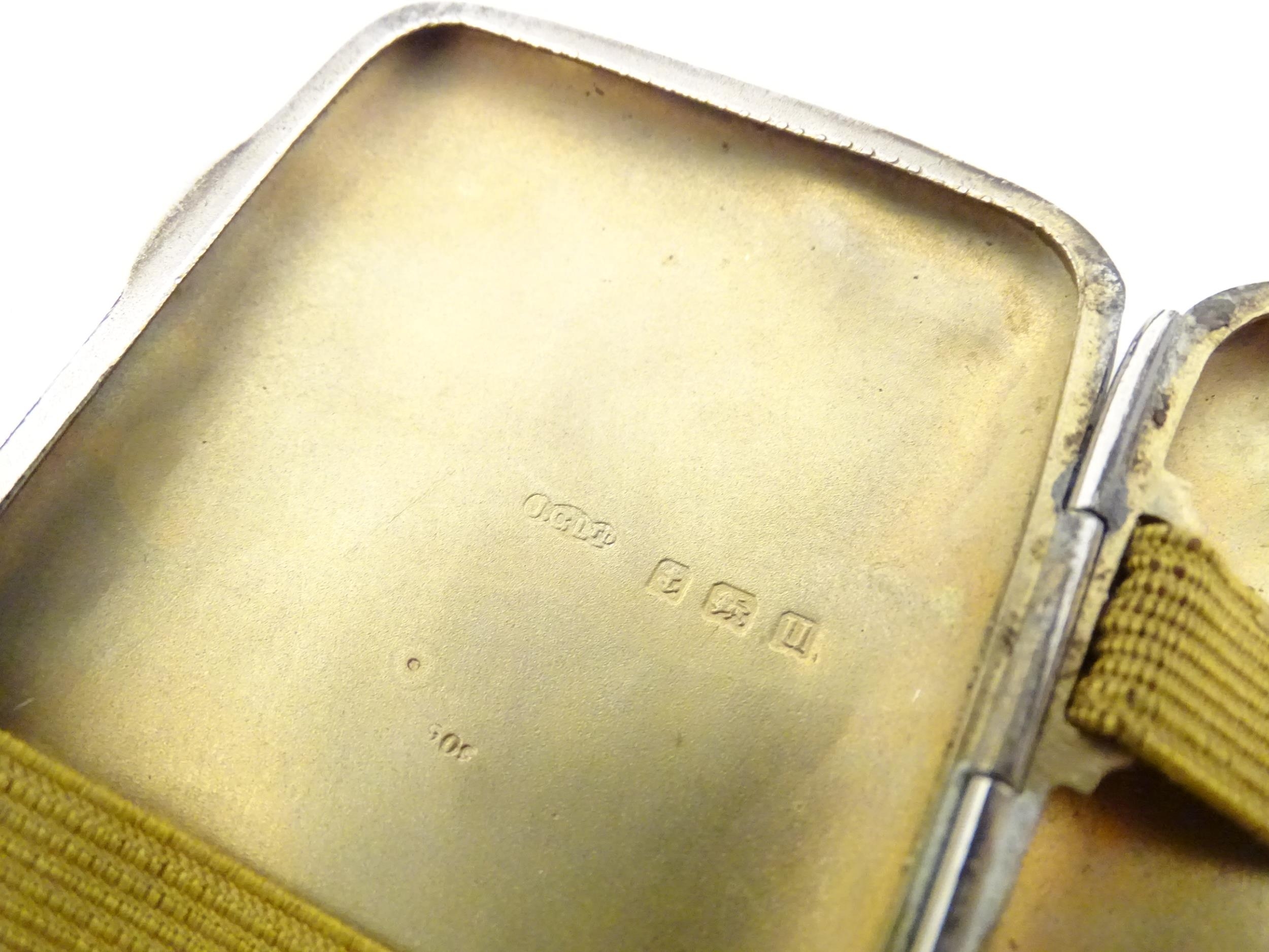 A silver cigarette case with engraved decoration, hallmarked Birmingham 1919, maker Joseph Gloster - Image 8 of 8