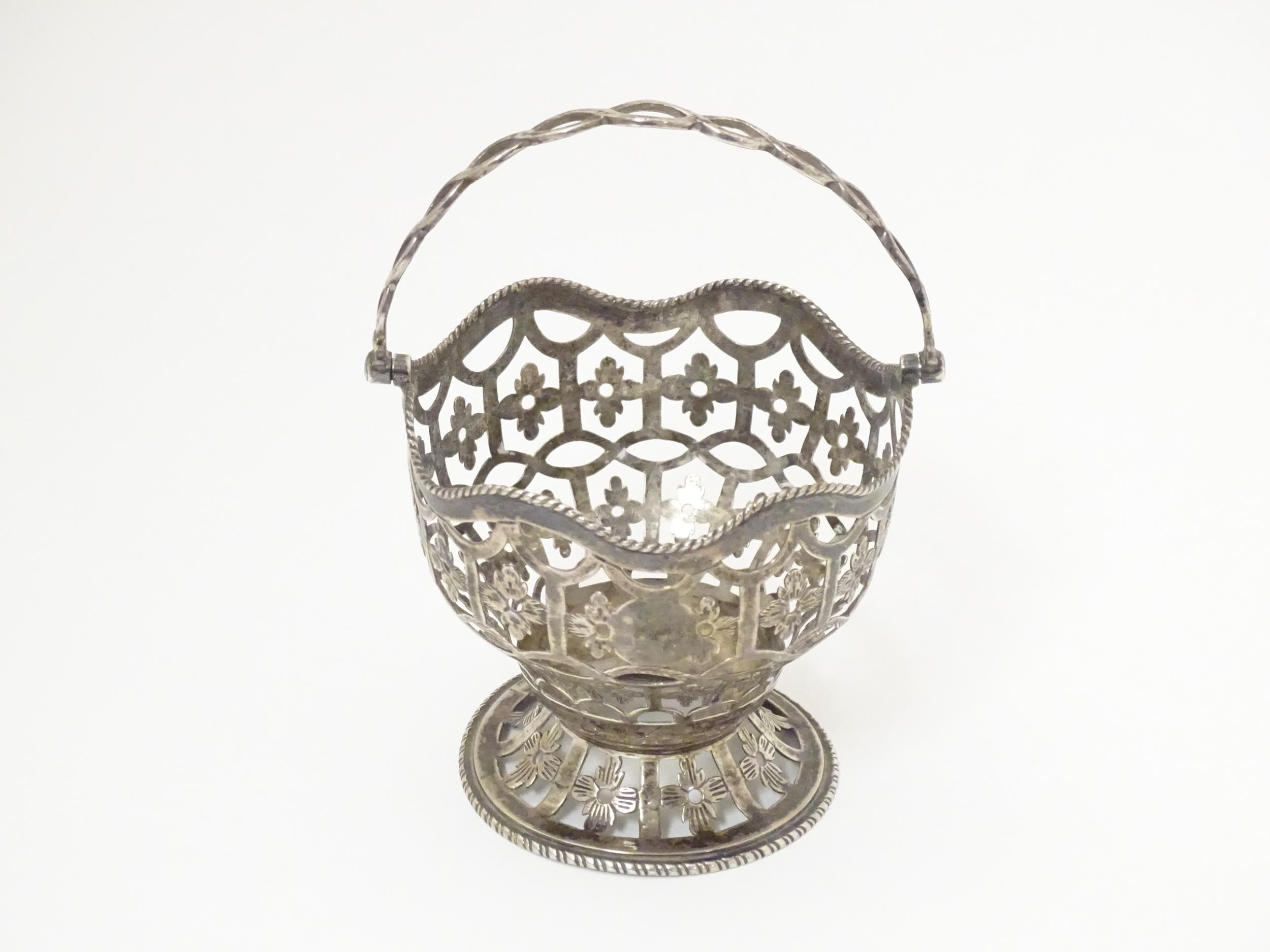 A Geo III silver sugar basket / sucrier hallmarked London 1772. Approx. 3 1/4" wide x 4 1/2" high (