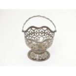 A Geo III silver sugar basket / sucrier hallmarked London 1772. Approx. 3 1/4" wide x 4 1/2" high (