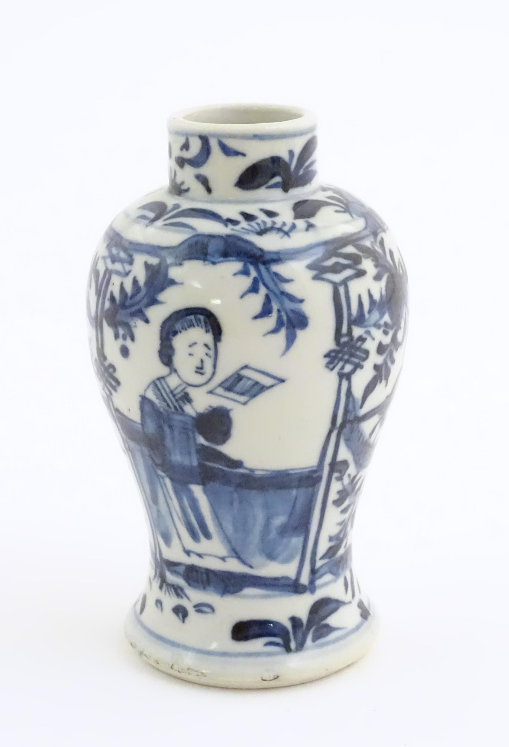 A small Chinese blue and white vase decorated with figures on a garden terrace with flowers and - Image 5 of 7