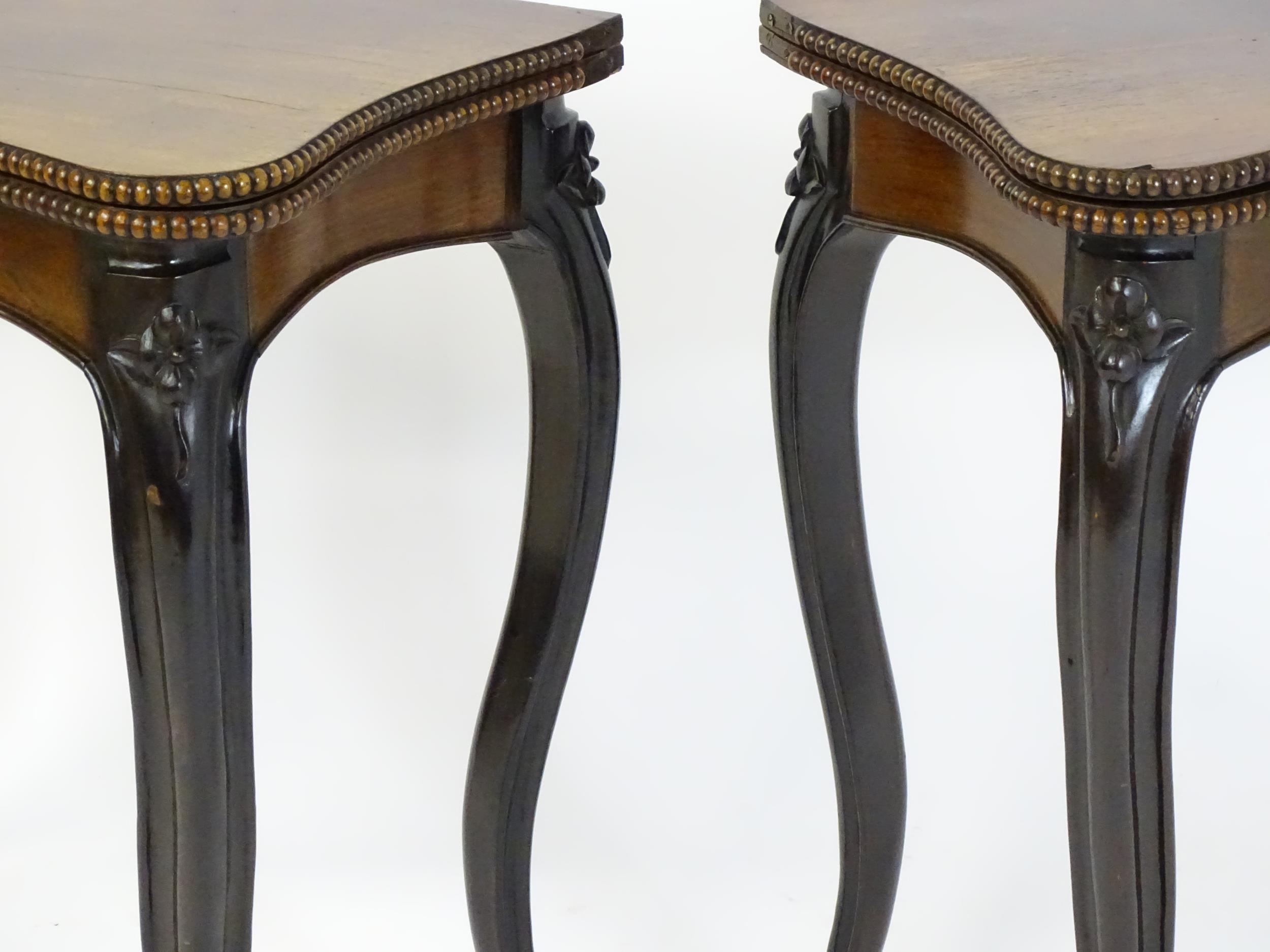A pair of 19thC rosewood card tables of serpentine form, having beaded edges above floral carved - Image 13 of 18