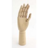 An artist's wooden articulated lay hand. Approx. 12" high Please Note - we do not make reference