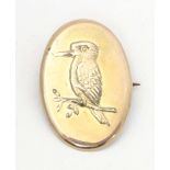 A gilt metal brooch with embossed kingfisher bird detail. Approx. 1 1/4" long Please Note - we do