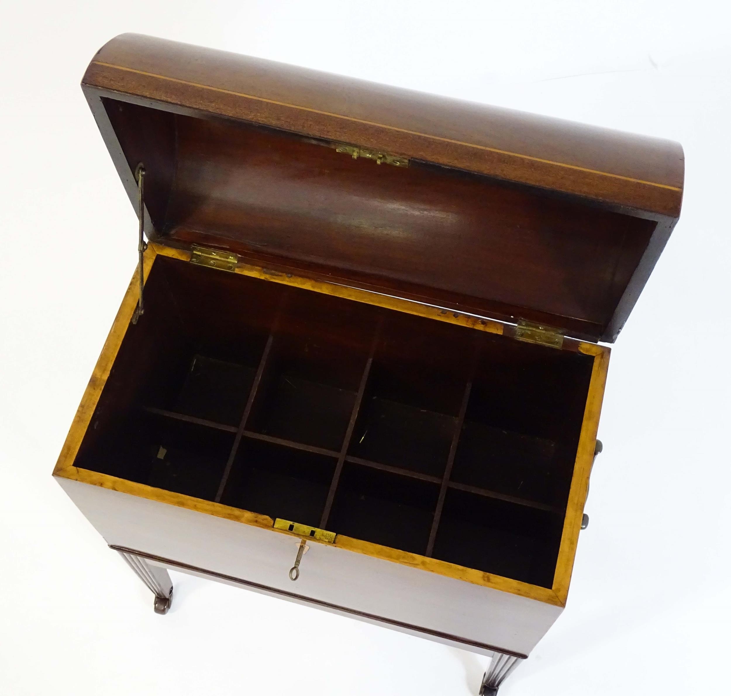 A George III mahogany domed lidded cellarette fitted with dividers for eight bottles, flanked by - Image 5 of 10