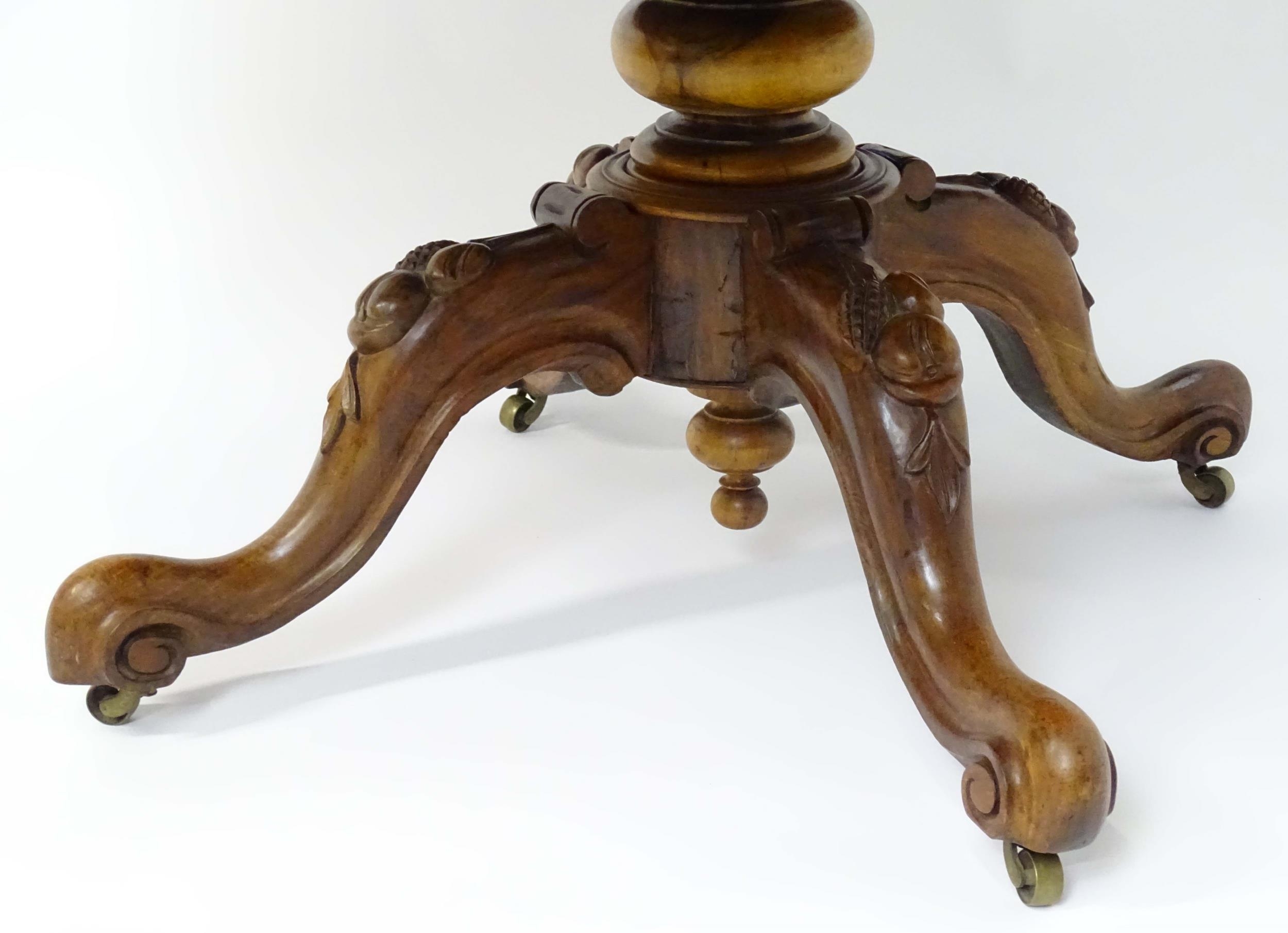 A mid 19thC walnut loo table with a burr walnut veneered top above a turned pedestal base and four - Image 3 of 12