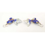 A pair of drop earrings set with enamel and gilt decorated articulated fish. Approx. 3 3/4" long