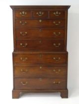 A mid / late 18thC mahogany chest on chest with moulded cornice above a dentil carved frieze, having