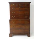 A mid / late 18thC mahogany chest on chest with moulded cornice above a dentil carved frieze, having