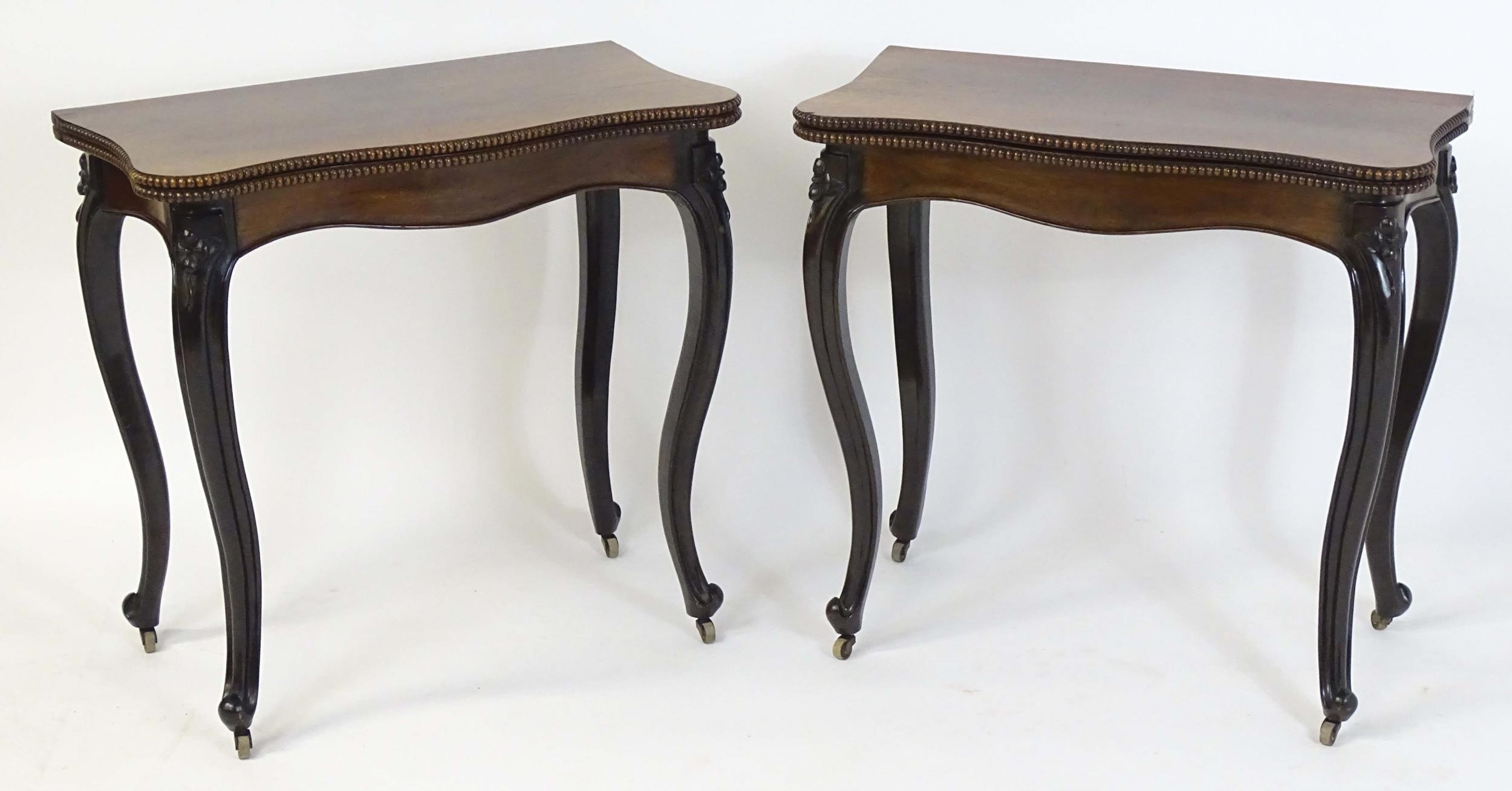 A pair of 19thC rosewood card tables of serpentine form, having beaded edges above floral carved - Image 3 of 18