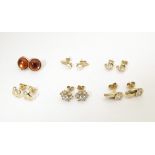 Six pairs of assorted stud earrings to include some gold and yellow metal examples. Please Note - we