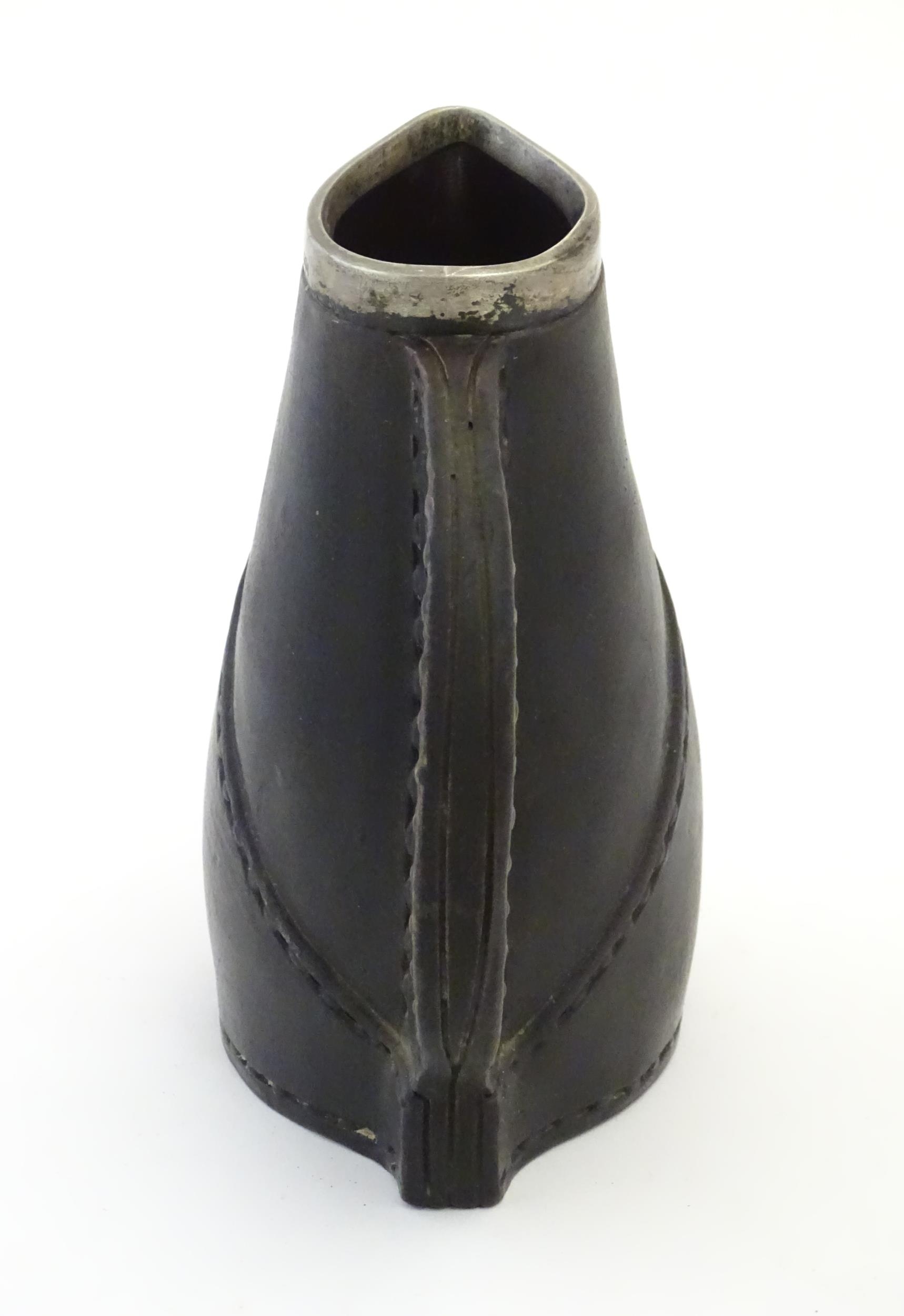 A Victorian Doulton Lambeth pottery jug formed as a leather jack with a silver rim hallmarked London - Bild 5 aus 7