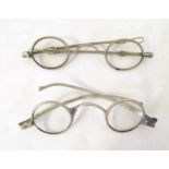 A pair of 19thC white metal spectacles / glasses by Pebbles, London, together with another pair (