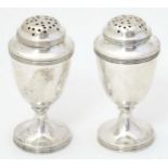 A pair of Victorian silver peppers hallmarked Sheffield 1898 maker Harrison Brothers & Howson. 3"