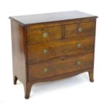 A late 18thC Georgian mahogany chest of drawers with a moulded top above two short over two long