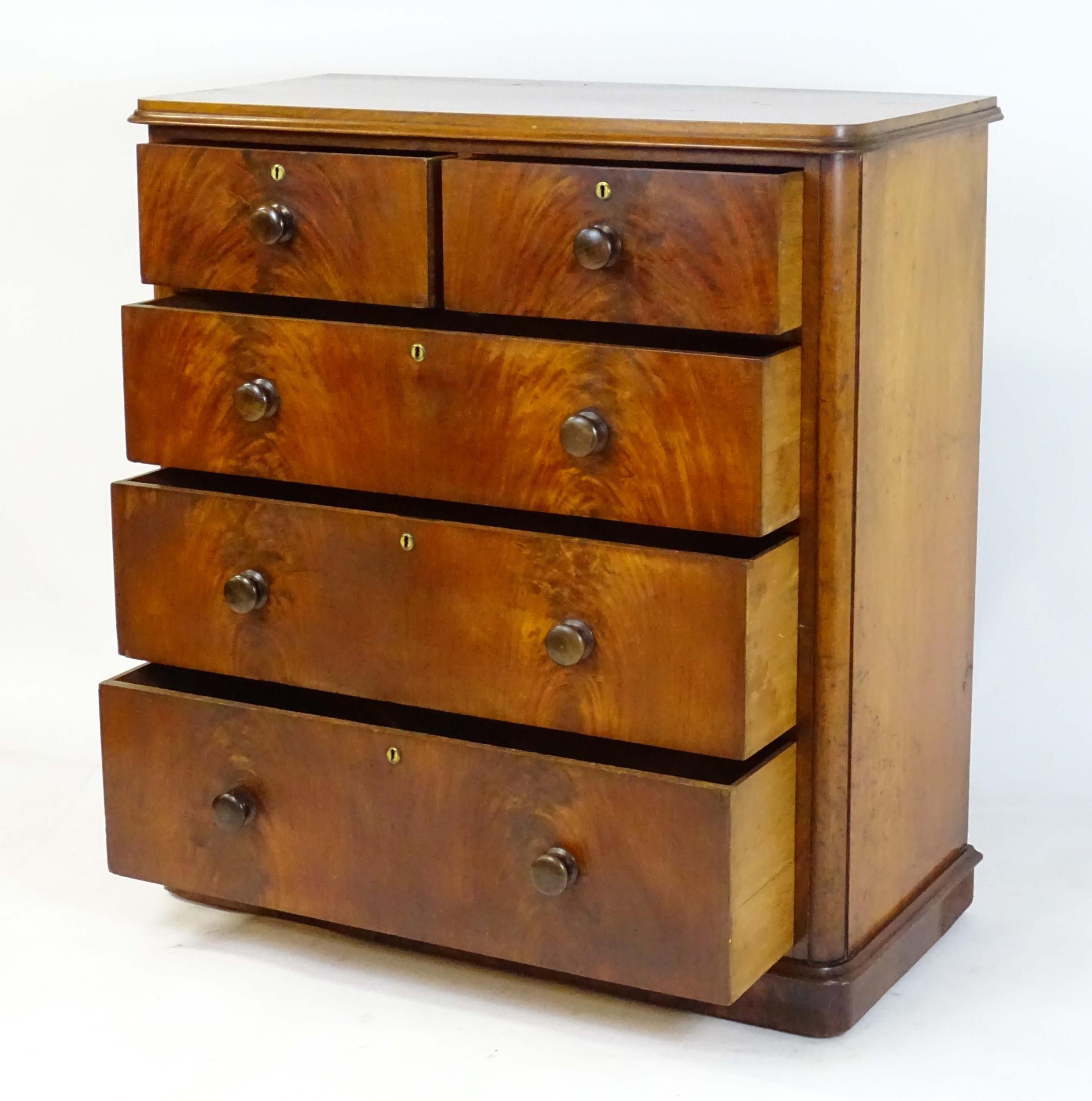 A large Victorian mahogany chest of drawers with a moulded top above two short over three long - Image 10 of 13