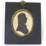 A 19thC miniature silhouette portrait of a gentleman with pencil highlights. Image approx. 3'' x 2