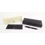 A cased Montblanc 'Meisterstuck' ballpoint pen, in black finish and decorated with gilt banding.