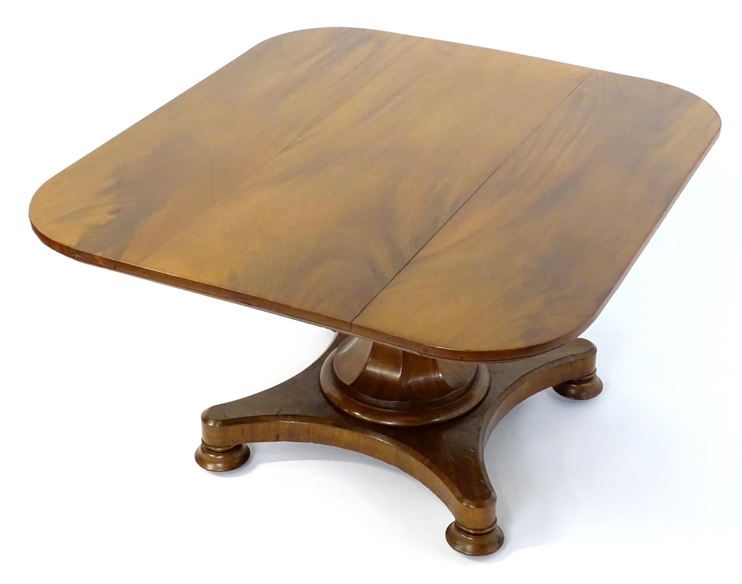 A Victorian mahogany tilt top table with rounded edges and standing on a pedestal base with - Image 7 of 8