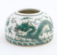 A Chinese brush wash pot of dome form decorated with dragons amongst stylised clouds. Character