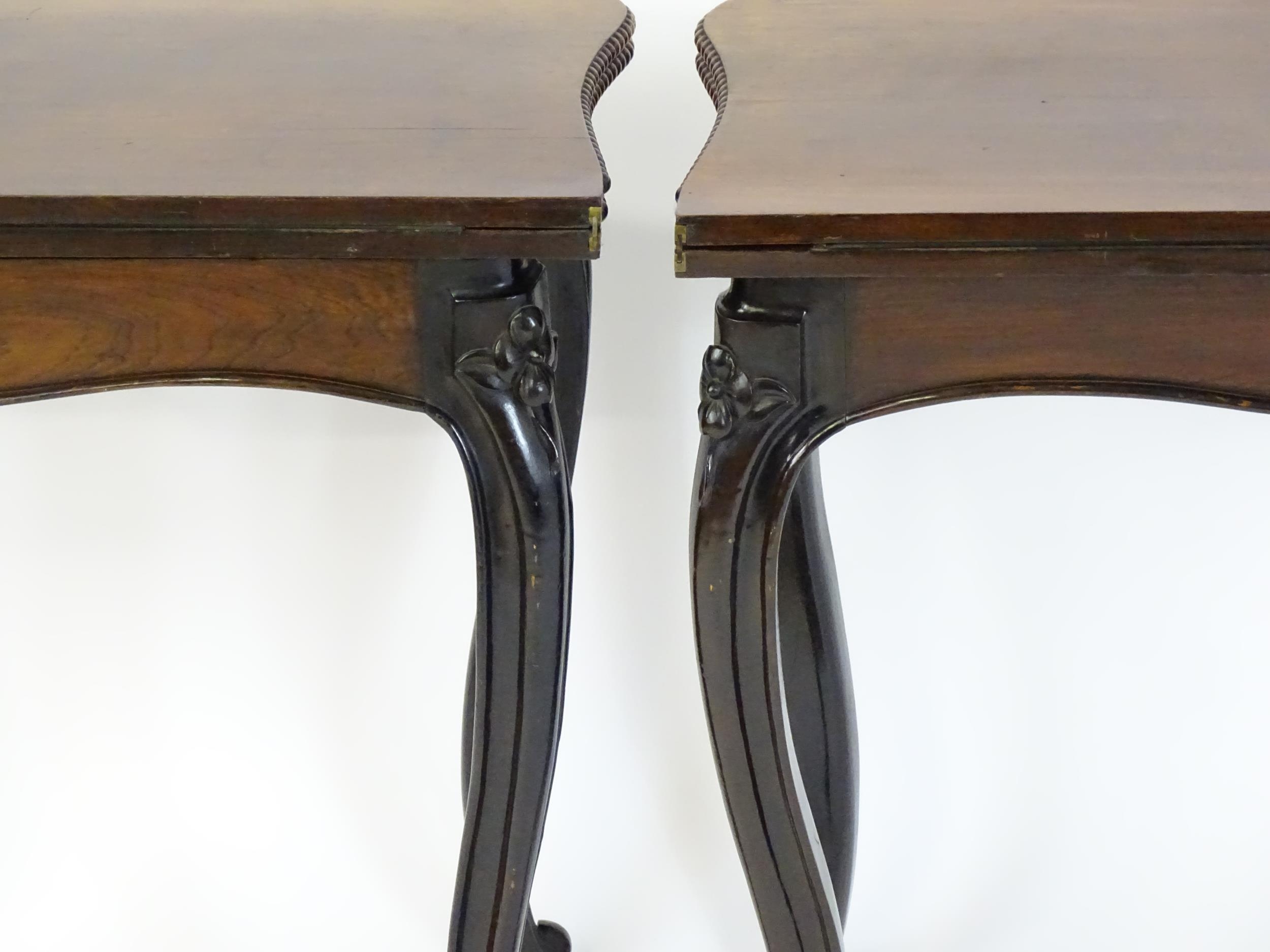 A pair of 19thC rosewood card tables of serpentine form, having beaded edges above floral carved - Image 2 of 18