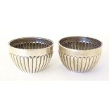 A pair of Victorian silver salts with fluted decoration hallmarked Chester 1900, maker Stokes &