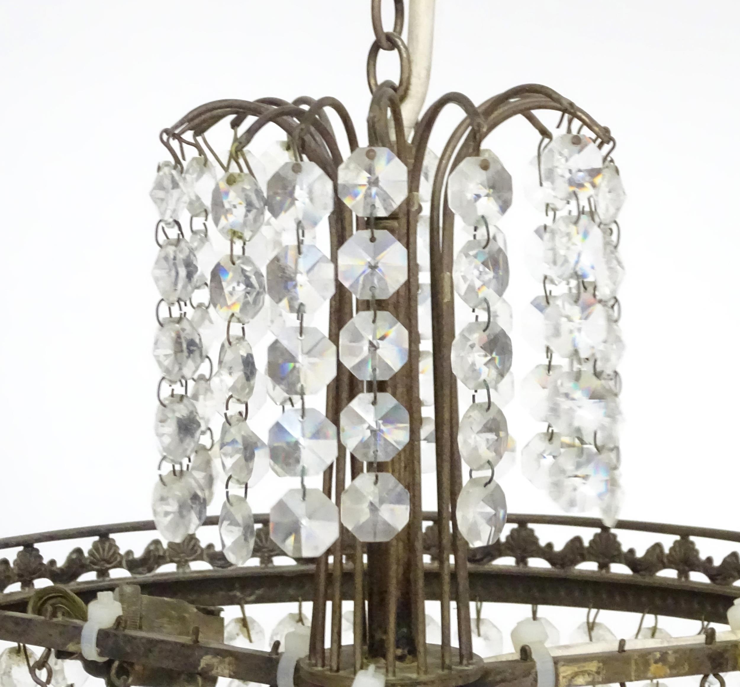 An early 20thC crystal drop bag pendant ceiling light, the chain supporting brass mounts with a - Image 5 of 8