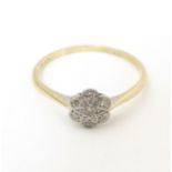 A 9ct gold ring set with chip cut diamonds in a platinum setting. Ring size approx. S Please