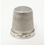 A silver thimble, hallmarked Birmingham 1941, maker James Swann & Son Please Note - we do not make