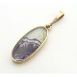 A 9ct gold pedant by David Scott-Walker, set with blue john and onyx. Approx. 1" long Please