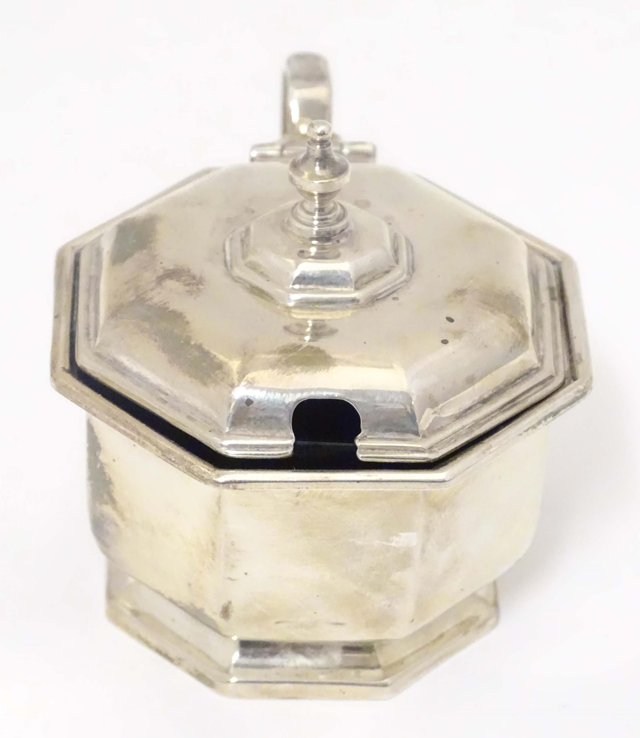 A silver mustard pot of octagonal form with blue glass liner. Hallmarked Birmingham 1933, maker - Image 3 of 7