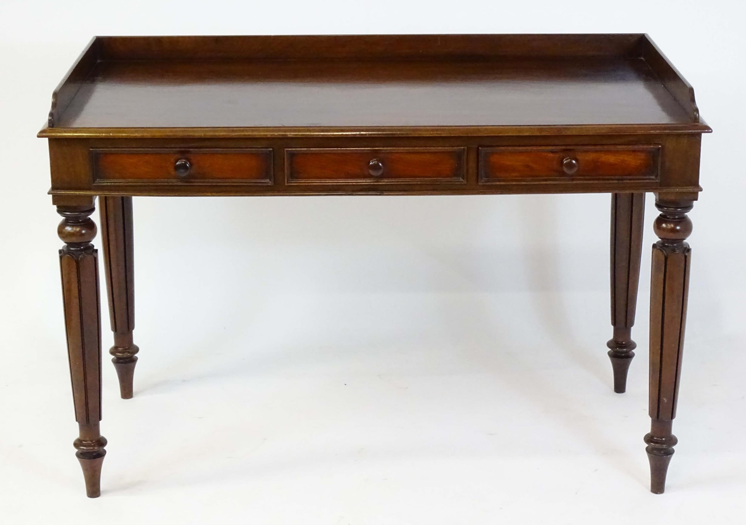 A Regency period mahogany dressing table with a shaped upstand above three shaped drawers and raised - Image 3 of 7