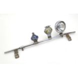 Automobilia: An early to mid 20thC chromed car / vehicle badge bar, with affixed Lucas 4LR headlamp,