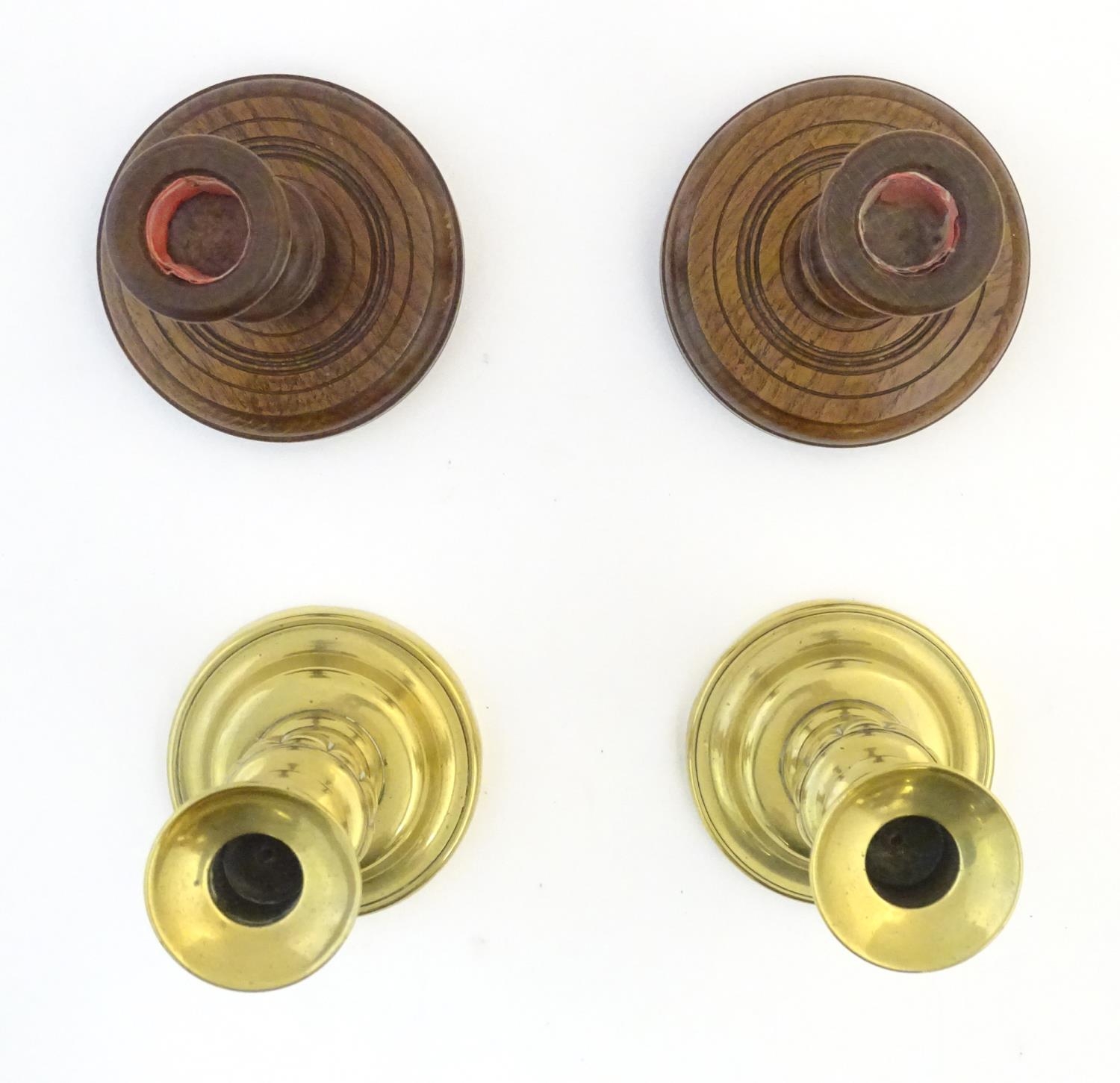 A pair of brass candlesticks with plunger action. Together with a pair of turned oak candlesticks. - Image 3 of 4