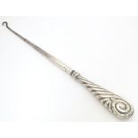 A Victorian silver handled button hook. Hallmarked Birmingham 1888 Approx. 10 1/2" long Please