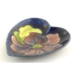 A Moorcroft dish of heart form decorated in the Clematis pattern. Marked under. Approx. 5" x 4 1/