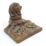 An early 20thC Continental Black Forest style carved inkwell / standish modelled as a bear on a tree