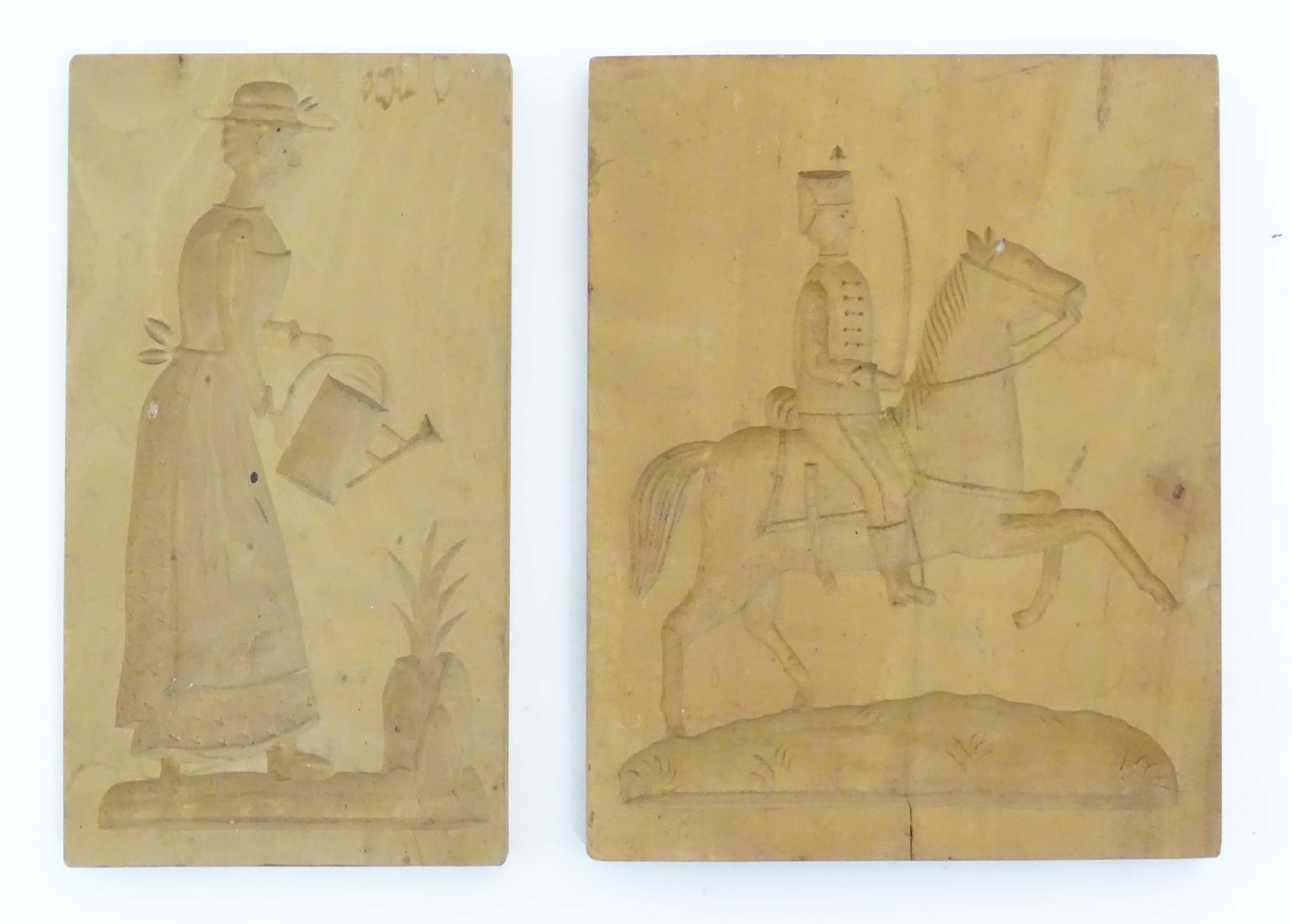 Two 20thC carved wooden shortbread / biscuit / cookie moulds, one depicting a soldier on