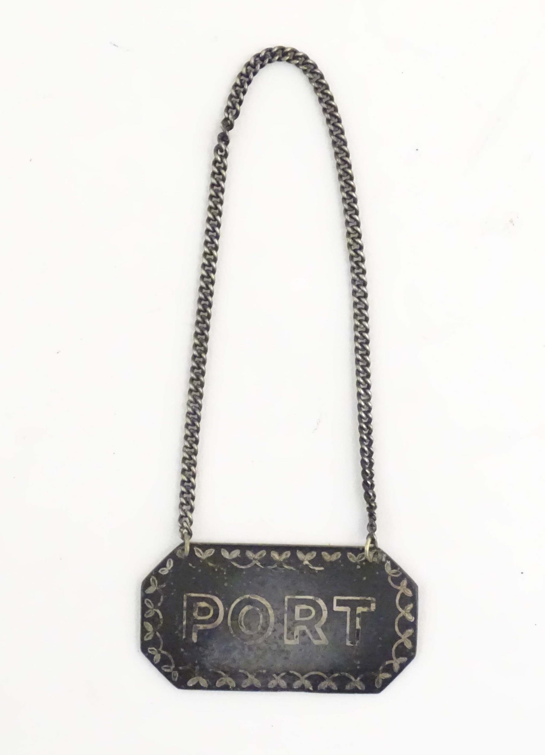 A 20thC wine / decanter label / bottle ticket titled Port. Approx. 2 1/4" wide Please Note - we do