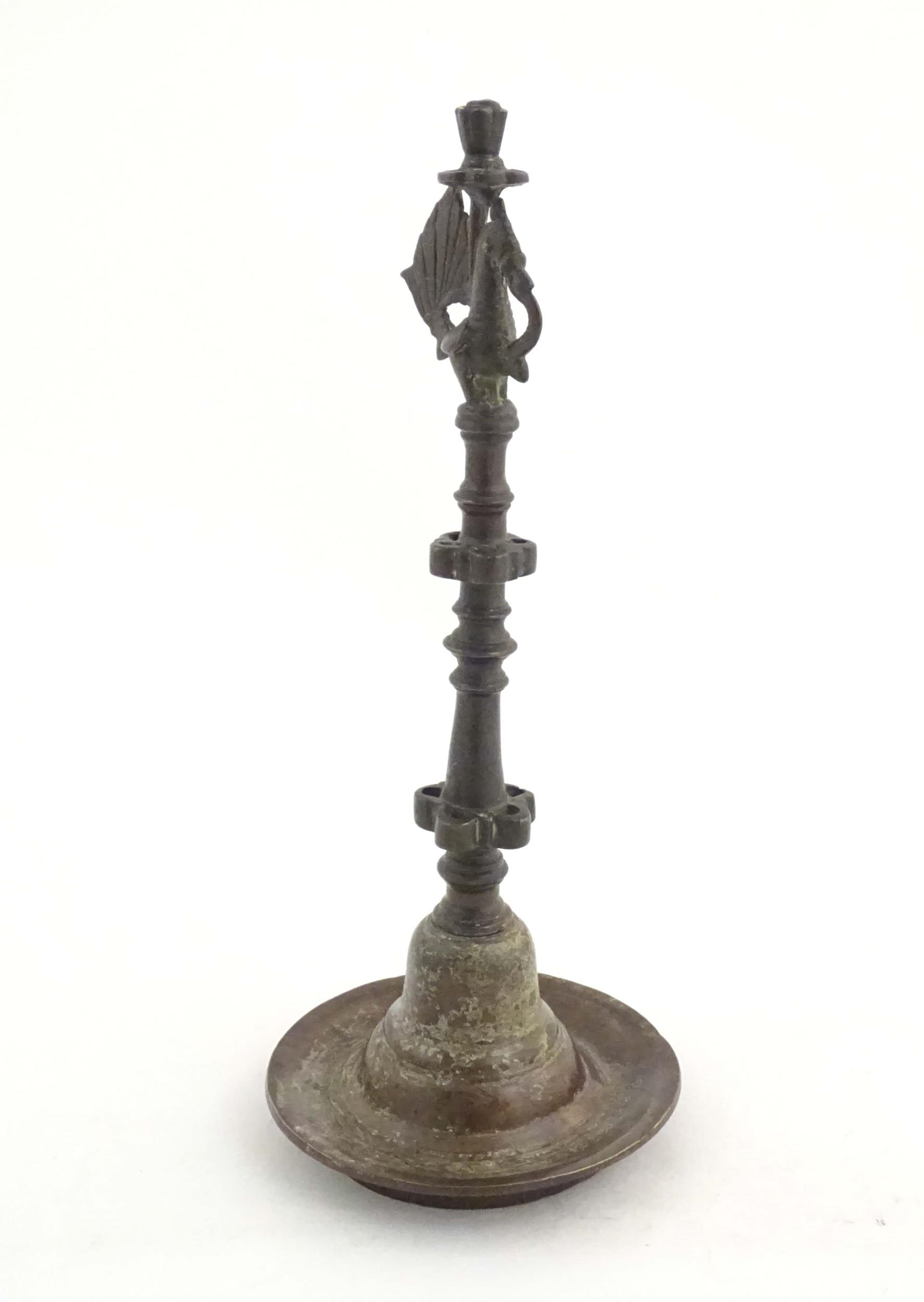 An Indian / Deccan cast temple style oil lamp with turned column surmounted by a Hamsa bird. Approx. - Image 3 of 8