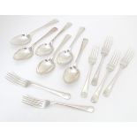 A set of six silver forks, together with a set of six silver spoons, all hallmarked London 1936,