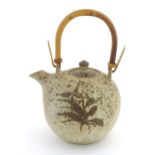 A Continental studio pottery teapot with brushwork detail. Marked under. Approx. 13" high Please